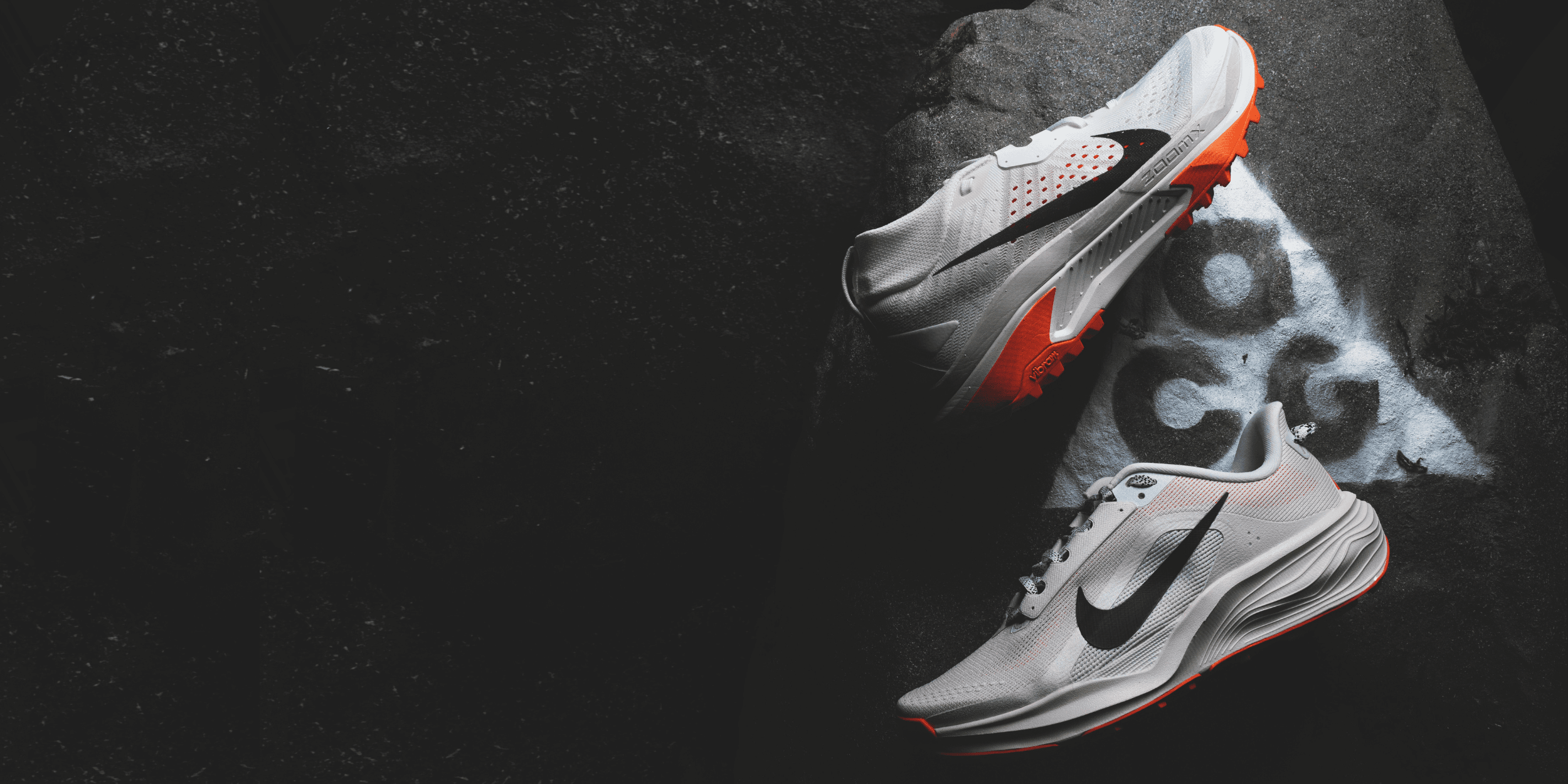Nike ACG trail running shoes on rock — ACG New Arrivals